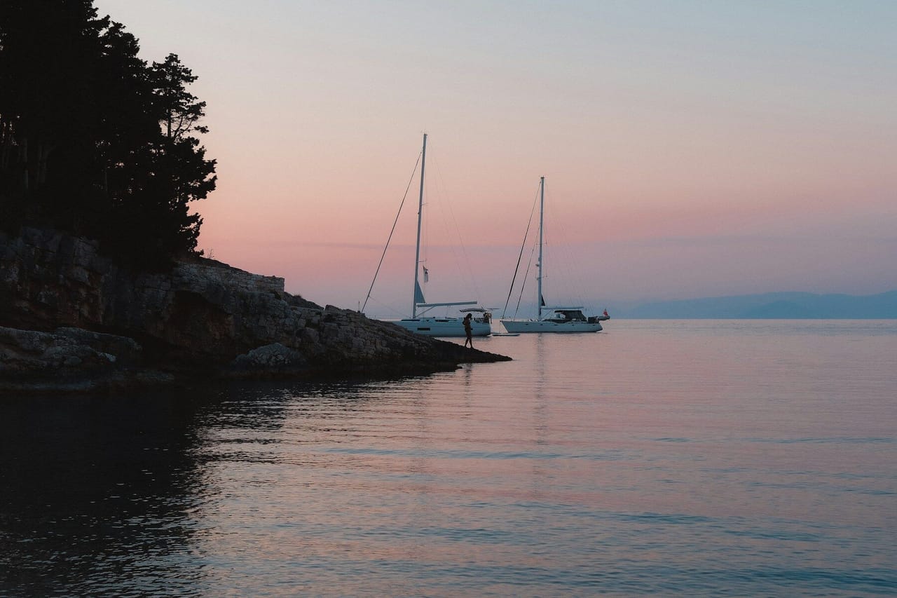 Sailing boats at dusk, Paxos